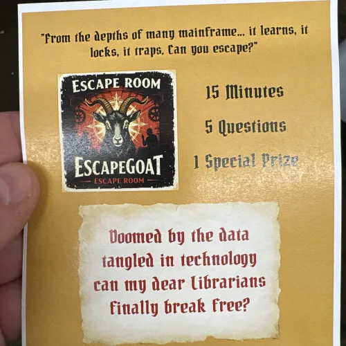 Flyer handed out at the conference featuring a goat icon & "Doomed by the data tangled in technology can my dear librarians finally break free?" At the bottom, a quote reads: "Once you log in... there may be no logging out! Enter the escape goat... if you dare!"